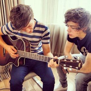 i would play the gutiar and drums .... i play the stupid clarniet (GRRRR) ( Louis & Harry Louis PLaying The Gutiar )