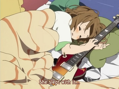 Yui is obsessed with Gitah, her guitar XD