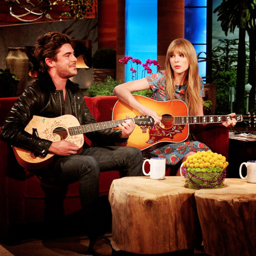 [i]Taylor with her guitar and Zac Efron , Singing <33[/i]