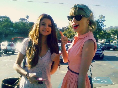  Mine :) *Taylor wearing something on her head like a hat au a headband. *Taylor with some other celebrity. ( Selena Gomez ) If u like my picture , Please vote <13