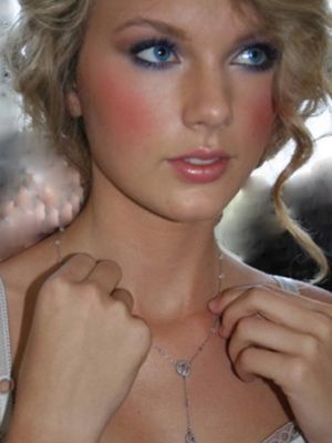  Tay with lots of makeup.:}