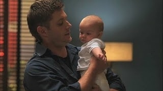  Here is Jensen as Dean Winchester holding ''Bobby John'', his pretending baby...The most gorgeous daddy in Earth :D <3