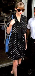  here is Taylor wearing a polka dot dress.:}
