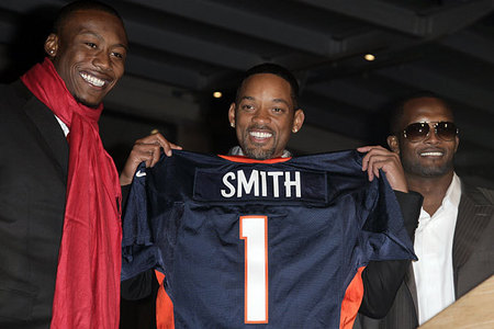  here is mine.It's Will Smith.Does it count if he is holding it and not wearing it?