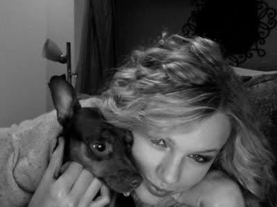  here is Taylor with a dog.:}