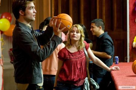  my Robert(Pattinson)holding a basketball. (I wish he was mine.The pic is a scene from Remember Me)