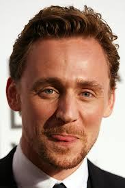  Hiddles doing his cheeky bite tongue thing he does.