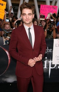  Here is my gorgeous,sexy Robert wearing a red maroon colored suit at the Eclipse premiere in 2010.<3