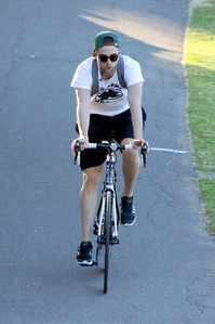  here's my Robert riding a bike.I would love to be riding right beside(or behind) him.Look at those sexy legs!!!.I wish it was a bicycle built for 2.<3