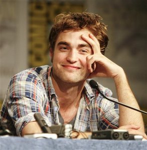  my Robert touching his oh so gorgeous face.I want to touch that handsome,sexy face<3