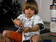  Little Matt with a toy in his hands. :)