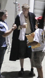  my baby on the set of Water for Elephants wearing a pair of black socks to keep his cute(and sexy)little piggies warm<3