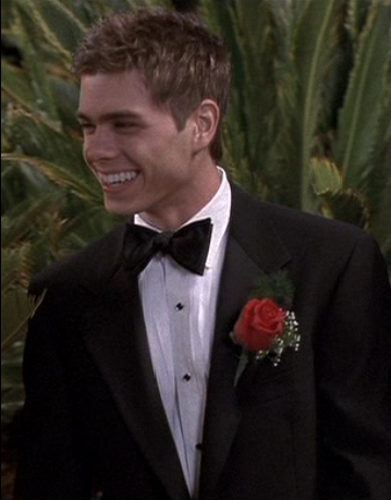  Matthew with a red rose on his tux. :)
