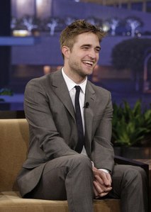 my sexy smiley Rob on Jay Leno with his sexy hands clasped together<3