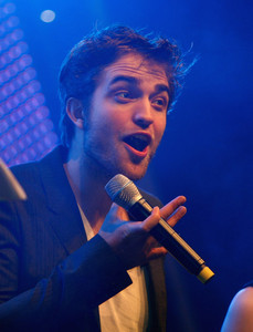  my baby holding a microphone<3