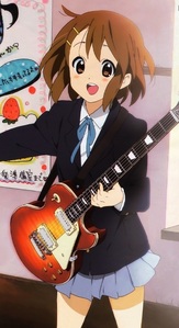  Yui playing the guitar.
