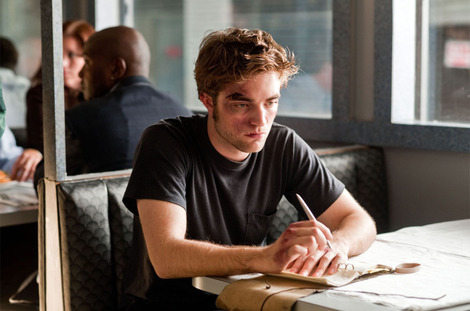  my baby in a scene from Remember Me holding a pencil(or a pen)<3