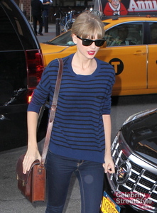 Taylor wearing blue striped shirt