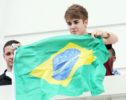  Justin Bieber, who has acted before, holding a Brazil flag :)