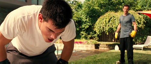Taylor Lautner getting punched by his dad(played by Jason Isaacs)in this scene from Abduction.He was teaching his son how to learn to defend himself.