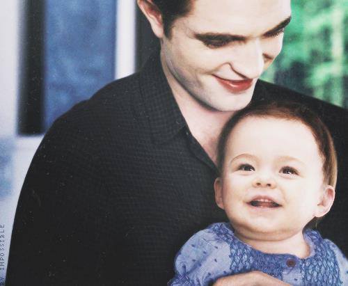  here is an adorable pic of my Robert in a scene from BD 2,where he is holding his daughter...aww<3