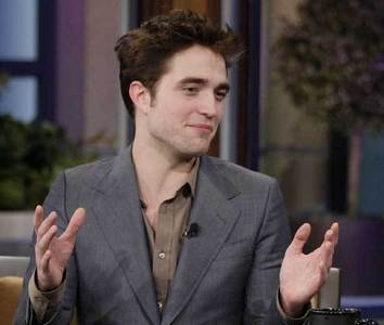  my handsome Robert on jay Leno with his hands spread open<3