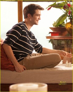  my handsome Robert wearing a black baju with stripes in this scene from BD part 1 <3