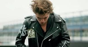  my gorgeous Robert fixing the zipper on his black leather jacket<3