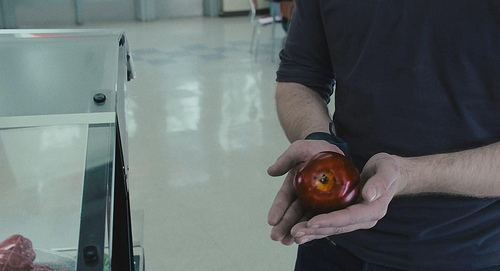  my gorgeous Robert holding a red mela, apple in this scene from Twilight<3