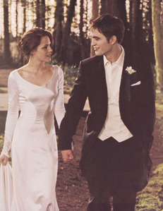  my gorgeous Robert standing beside his girlfriend/co-star,Kristen Stewart in a scene from BD part 1,just after their characters Edward and Bella became husband and wife<3