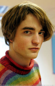  my handsome Robert wearing a bright and colorful sweater from one of his earlier movies<3