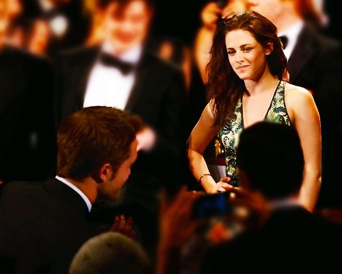  the beautiful Kristen Stewart looking at my baby at the Cannes Film Festival<3