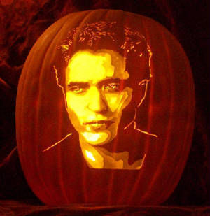  my baby's gorgeous face carved on a pumpkin,now that is my idea of a treat<3