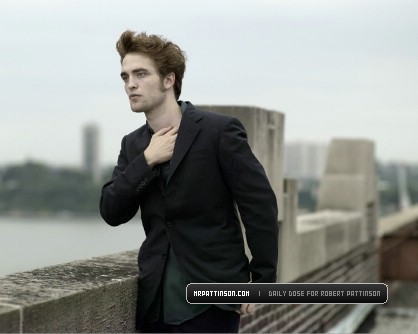  my handsome Robert doing a promo shot for Remember Me,with a website in the bottom right corner<3