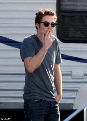  my smoking hot baby standing near a trailer having a cigarette break<3