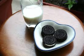  OREOS AND MILK!!!!! I can eat them all giorno long till they give me diabetes and kill me! XD