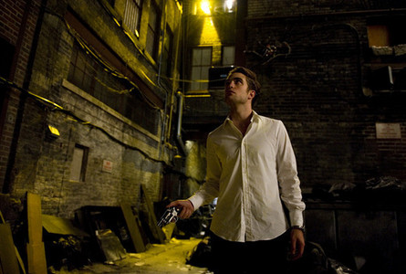  my baby in a scene from Cosmopolis with a gun in his hand<3