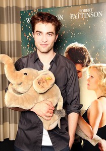  I find this pic of my baby holding a stuffed elephant,which he autographed,very adorable<3