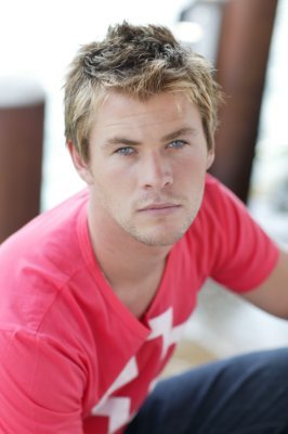  a younger Chris Hemsworth in a red shirt<3