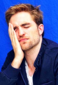  my gorgeous Robert resting his head on his hand<3