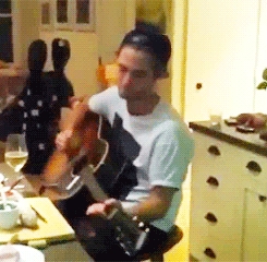  my gorgeous baby playing the guitar<3