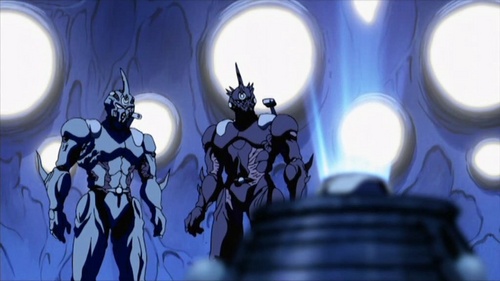 Sho Fukamachi and Agito Makishima aka Guyver 1 and Guyver 3, respectively, observing the control medal computer system activating and shining inside this alien ship in Guyver The Bioboosted Armor 