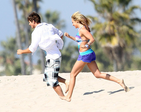  Matt Lanter running on the plage with Ashley Tisdale