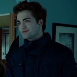  my gorgeous Robert in a scene from Twilight wearing a blue coat<3