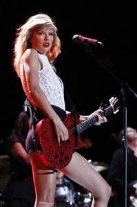 Taylor with a red guitar