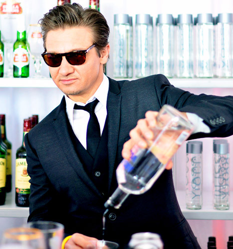 I couldn't find any pics of Robert,so here's Jeremy Renner pouring a drink<3