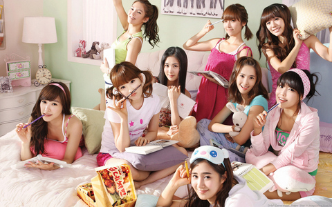 These girls are really good students. All of them are doing their homework ;)
