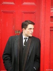  my red hot Amore standing in front of a red door from the set of his new movie currently filming in Toronto<3