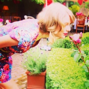  Taylor looks so cute smelling the rose
