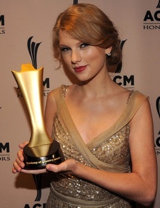 Here is a picture of her with her award:) her lucky number is 13!! And her brother's name is called Austin!:P